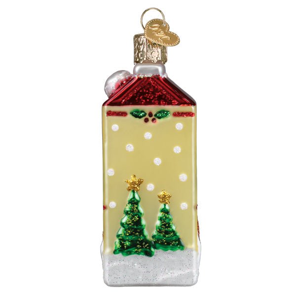 Side of the eggnog carton ornament painted with polka dots and two green Christmas trees, on white