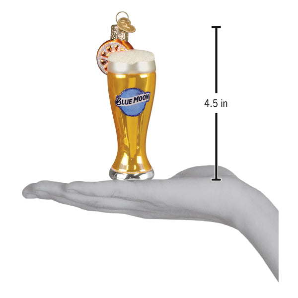 Blue Moon beer glass ornament resting on a hand with a 4.5 inch height marker for scale