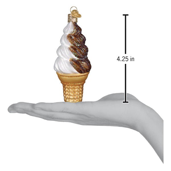 Chocolate swirl soft serve ornament on an open palm with a 4.25 inch height marker