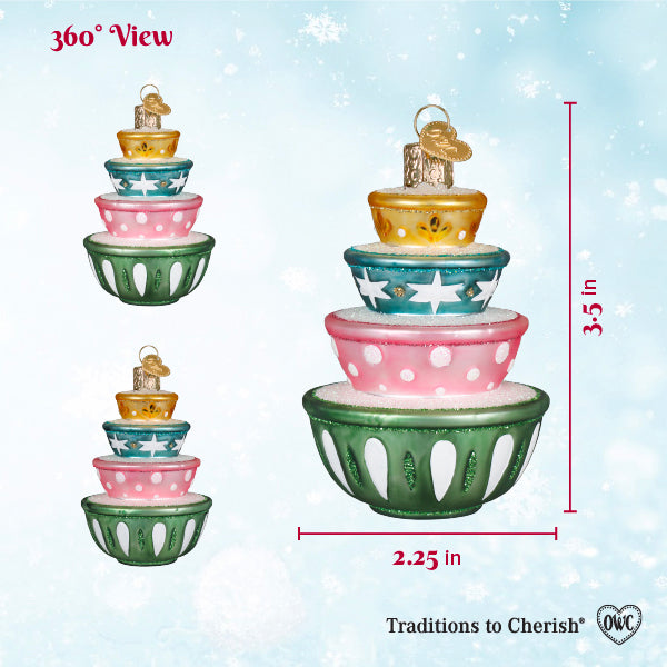Sizing chart for the stacked mixing bowls ornament on a snowy blue background with height and width markers