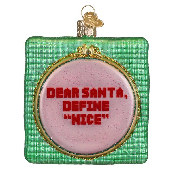 Dear Santa ornament, front view of a gold hoop cross stitch reading Dear Santa, define nice on green, on white
