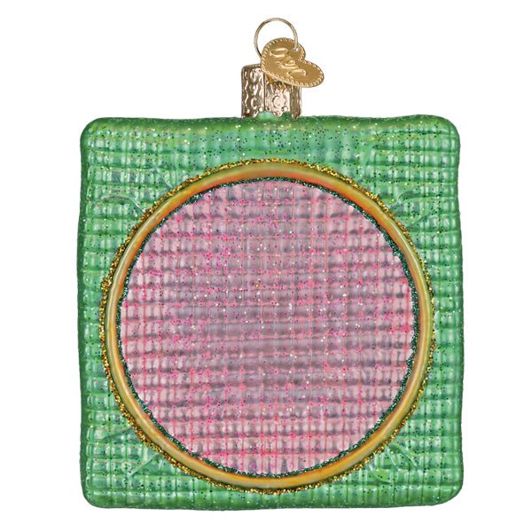 Back of the Dear Santa ornament with a pink stitched circle inside a gold hoop on green, on white