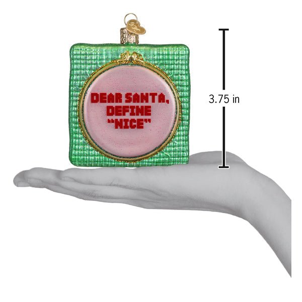 Dear Santa ornament on an open palm beside a 3.75 inch height marker