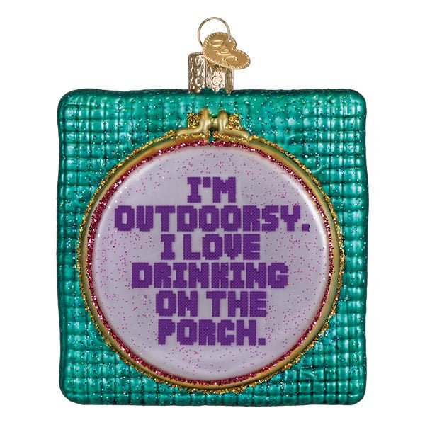 Teal stitched hoop ornament reading I'm Outdoorsy. I Love Drinking on the Porch in purple, on white