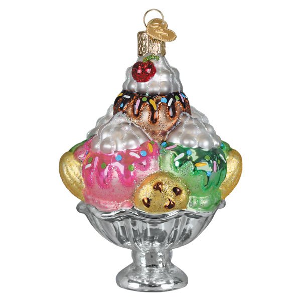 Front of the ice cream sundae ornament with pink, green, and chocolate scoops and a cherry in a silver dish, on white