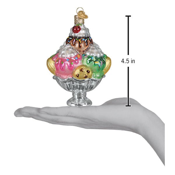 Sundae ornament on an open palm beside a 4.5 inch height marker