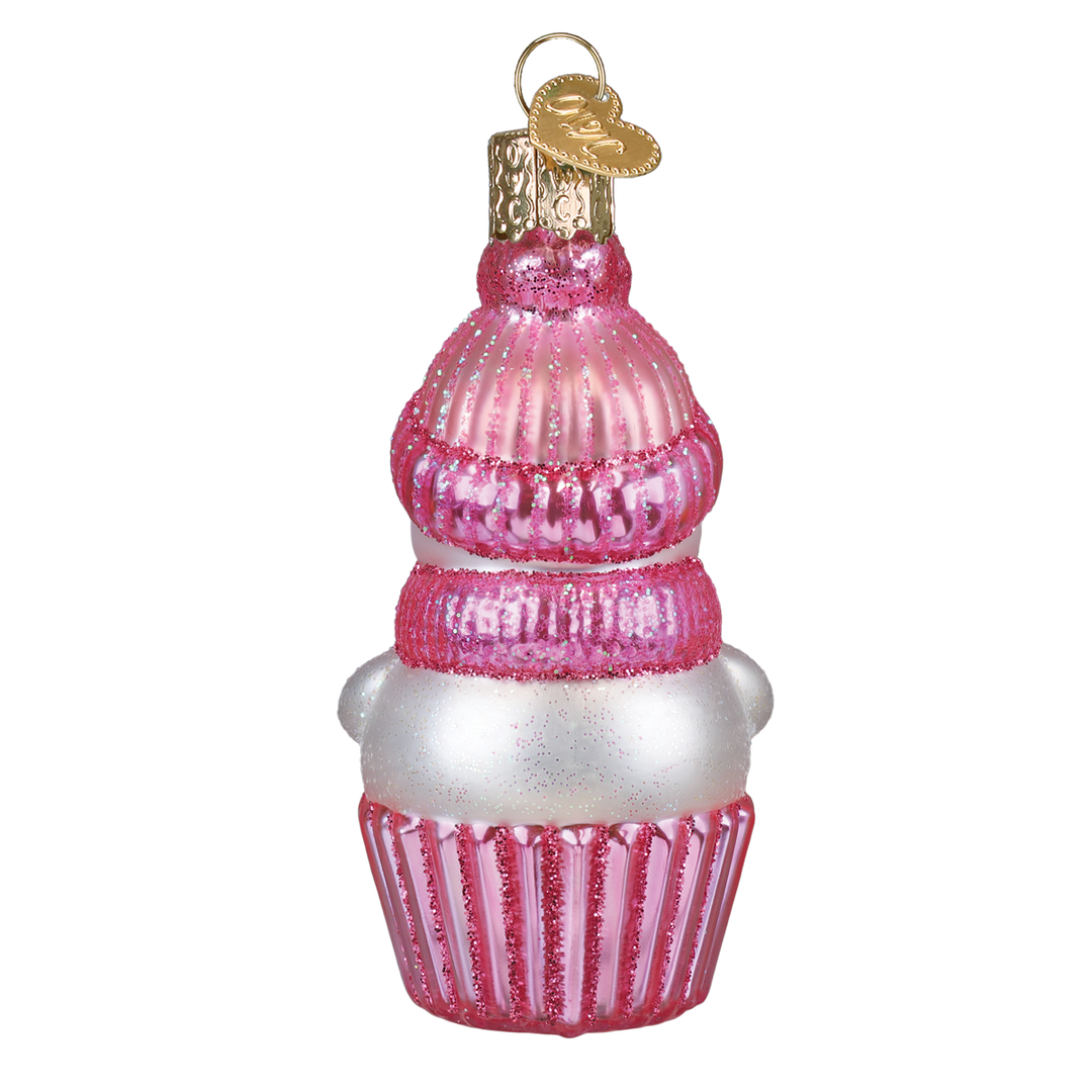 Back of the pink snow baby ornament showing the knit hat and glitter cupcake wrapper