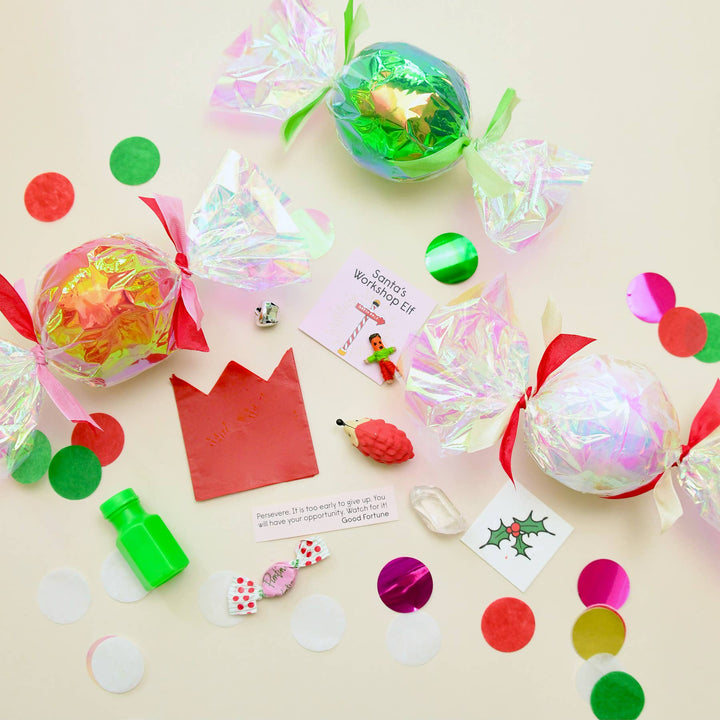 Iridescent bon bon surprise balls with confetti, bubbles, a fortune, and elf prizes for a holiday party