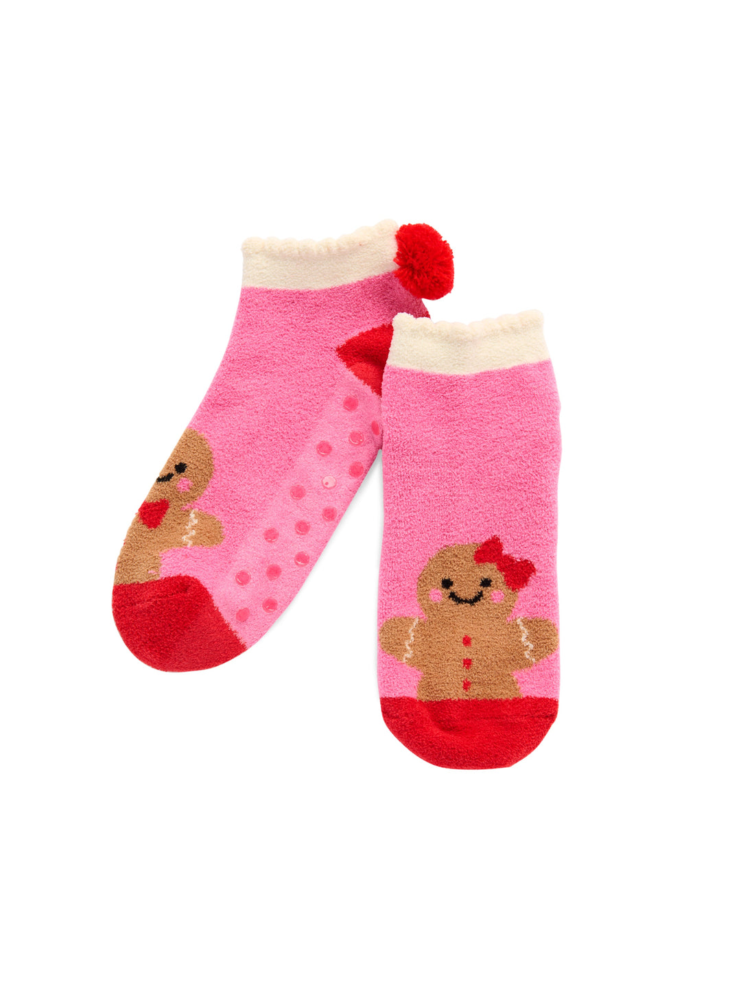 Pink gingerbread socks showing the rubber grip bottoms on white