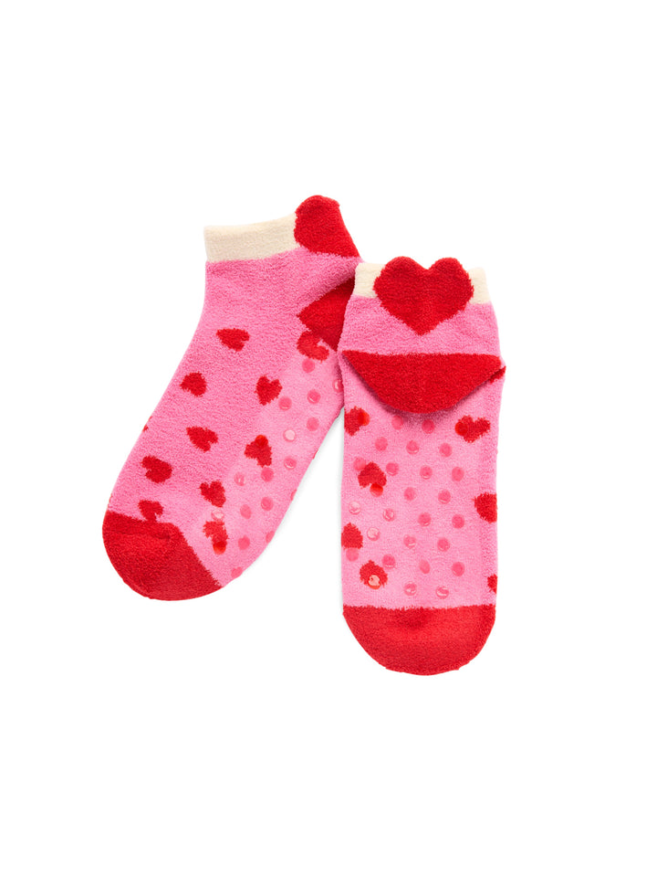 Pair of pink heart socks with a plush heart at the heel
