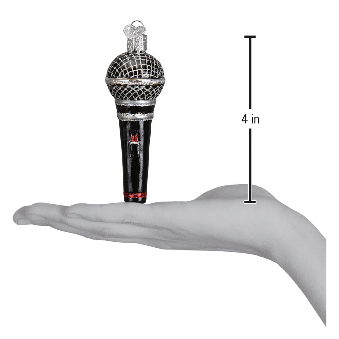 Microphone ornament on an open palm beside a 4 inch height marker