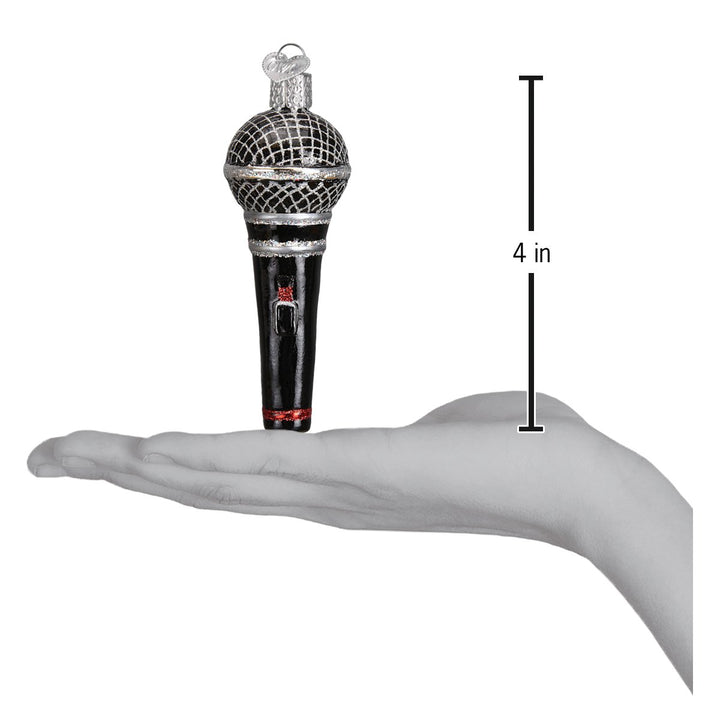Microphone ornament on an open palm beside a 4 inch height marker