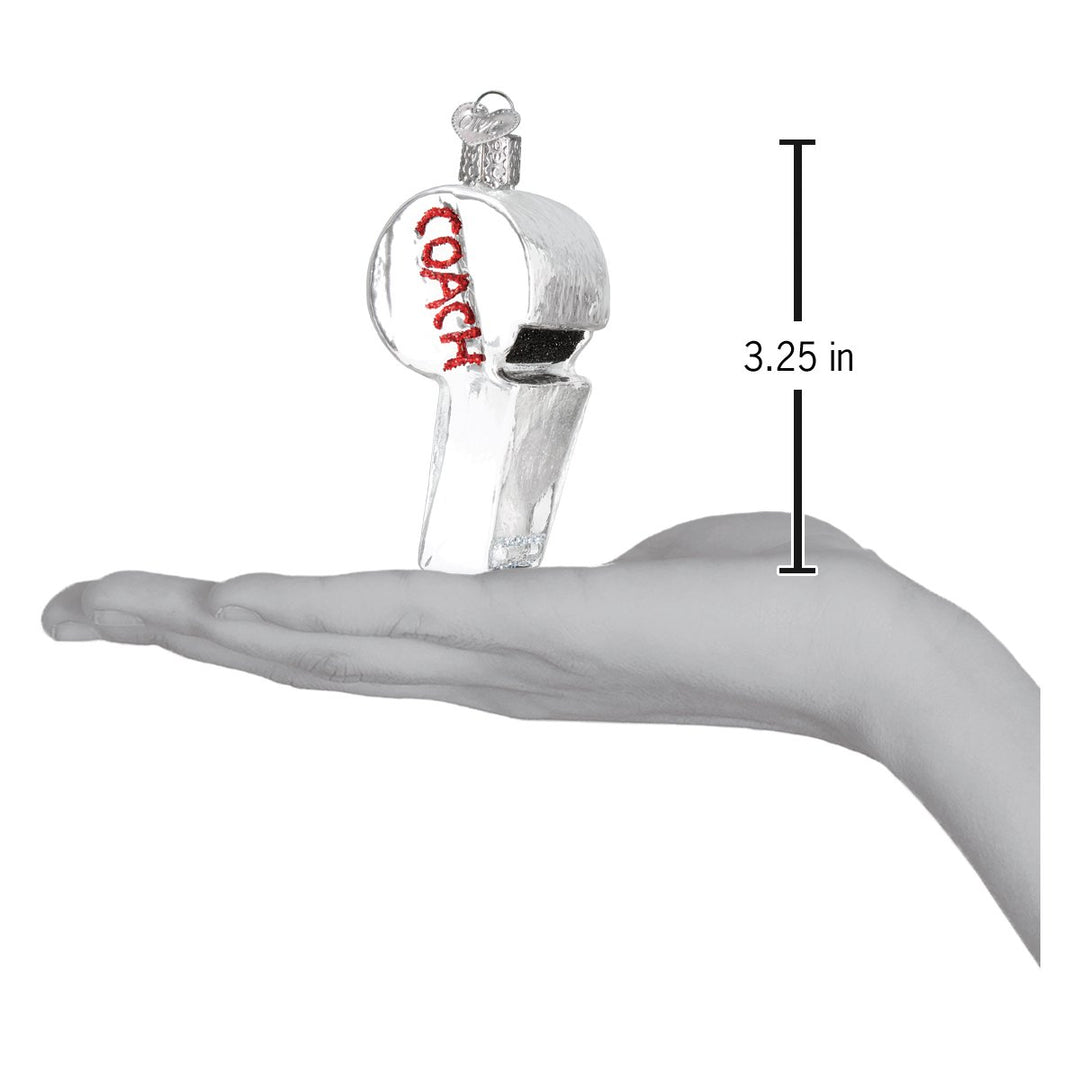 Coach's whistle ornament on an open palm beside a 3.25 inch height marker