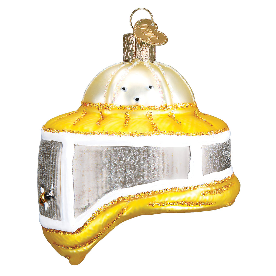 Side view of the beekeeper's hood ornament showing tiny bees on the mesh veil