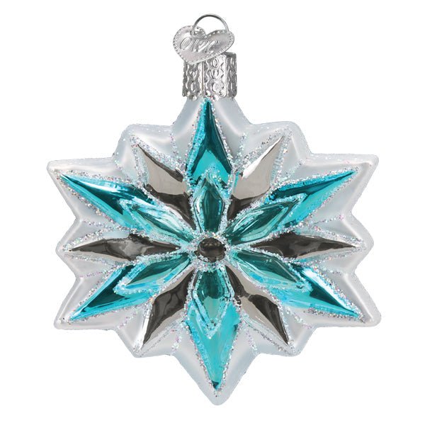 Icy blue snowflake ornament with frosted white edges and aqua and silver points, on white
