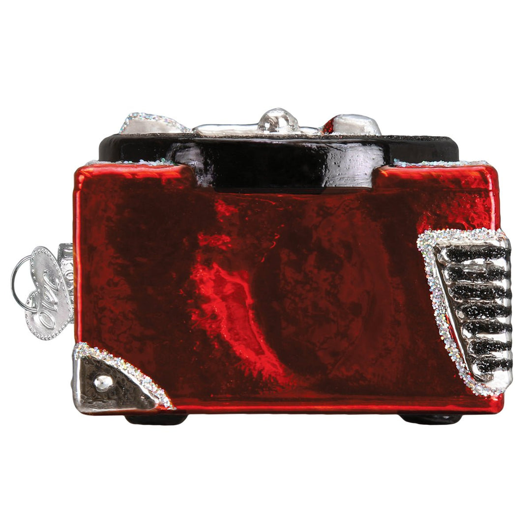 Back of the red record player ornament with glittered red case and silver corner trim, on white