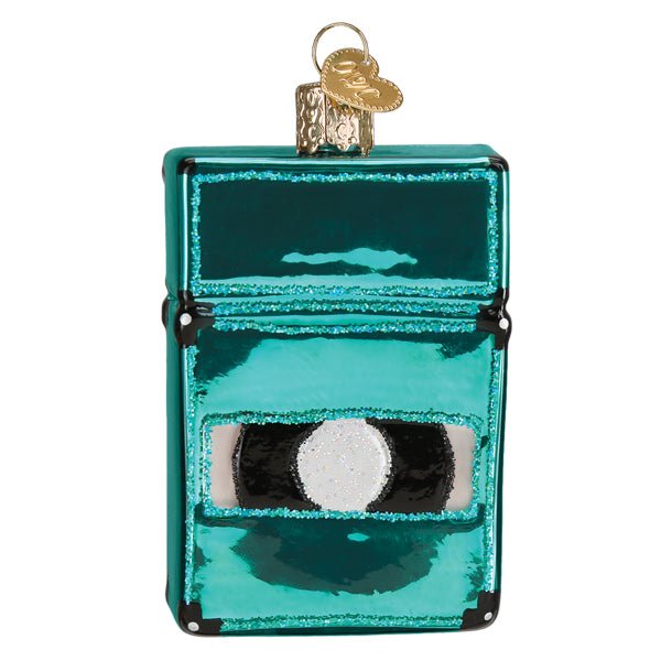 Back of the teal amplifier ornament with its glossy cabinet and round rear port, on white