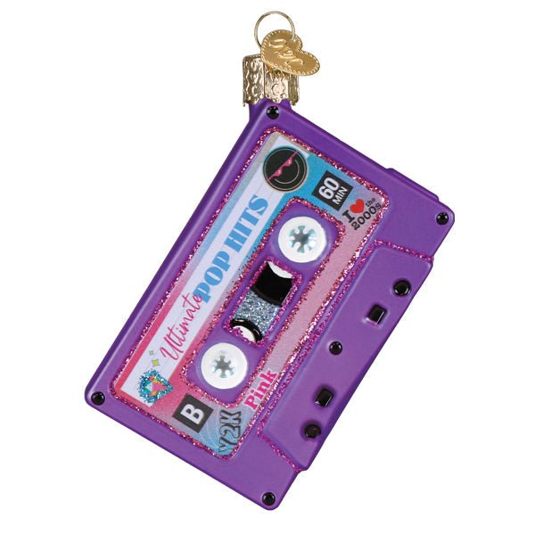 Side B of the purple cassette ornament reading Ultimate Pop Hits with a Y2K sticker, on white