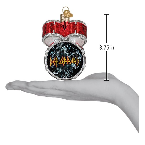 Def Leppard drum ornament shown in an open hand for scale