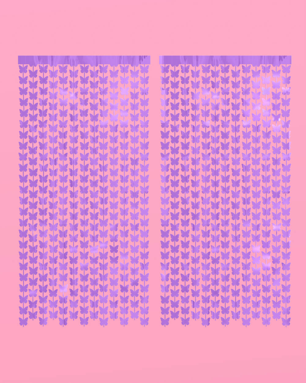 Two purple butterfly curtain panels hung side by side on a pink wall