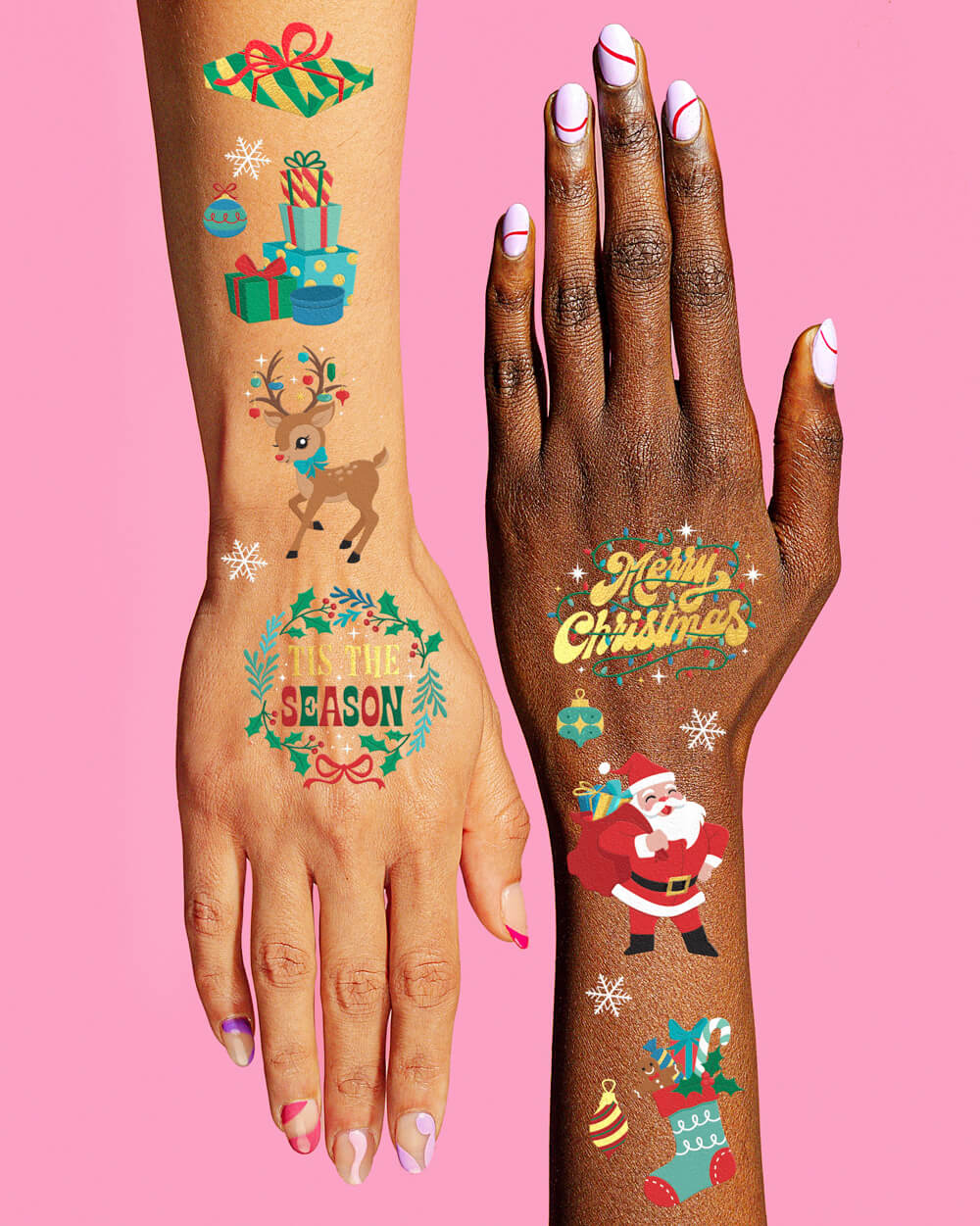 Arms wearing Christmas temporary tattoos including Tis the Season, Merry Christmas, Santa, a reindeer, and stockings