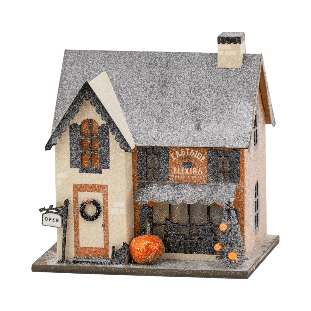 Eastside Elixirs haunted village house, a miniature apothecary shop Halloween decoration, front view