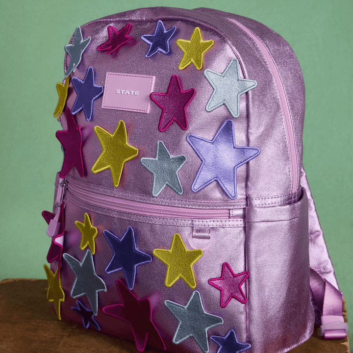 Close-up of the layered metallic star appliques on the 3D Stars Kane backpack