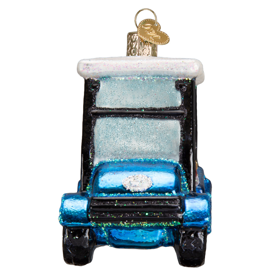 Front view of the golf cart Santa ornament showing the blue hood and frosted windshield, on white