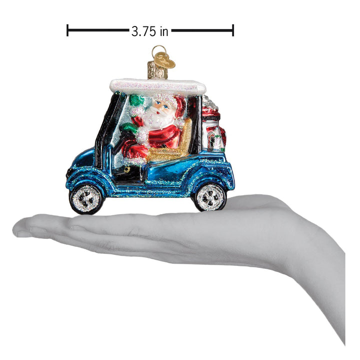 Golf cart Santa ornament on an open hand with a 3.75 inch scale marker above it