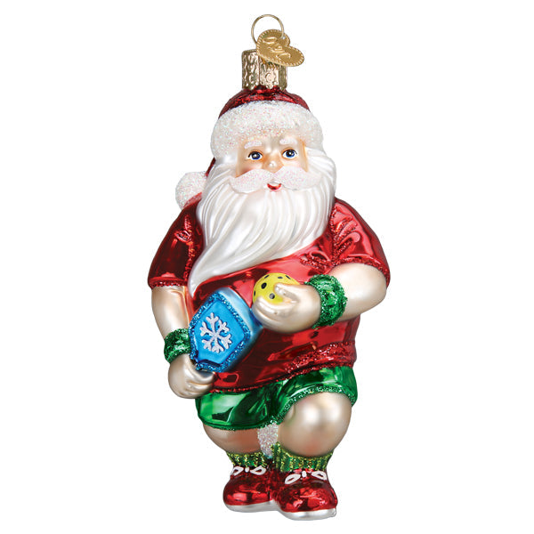 Front of the pickleball Santa ornament with a blue paddle, yellow ball, and green shorts, on white