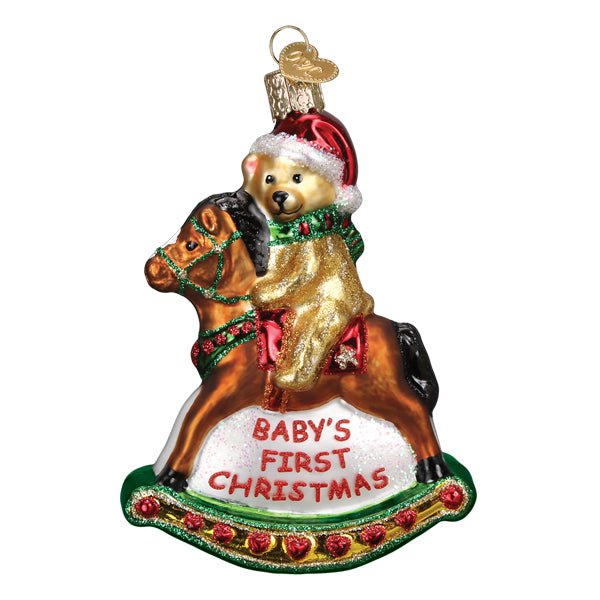 Front of the rocking horse teddy ornament with a teddy in a Santa hat above Baby's First Christmas, on white