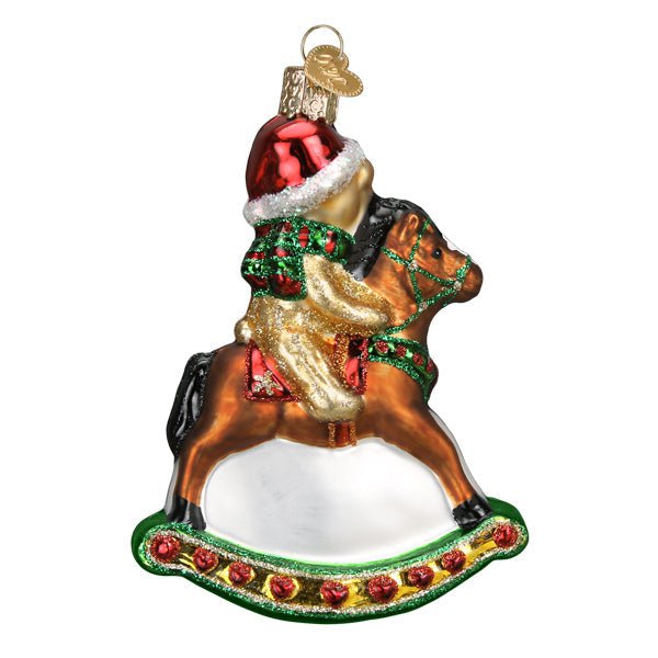 Back of the rocking horse teddy ornament with a blank white rocker and the bear's Santa hat, on white