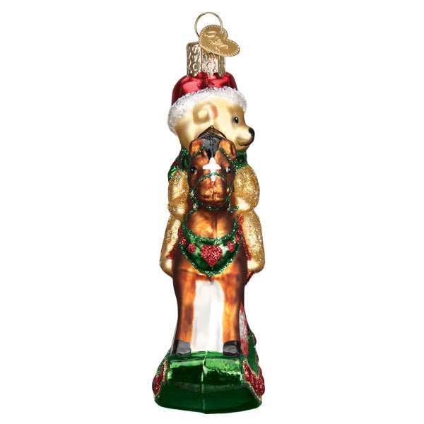 Head-end view of the rocking horse ornament showing the horse's face and the teddy rider, on white