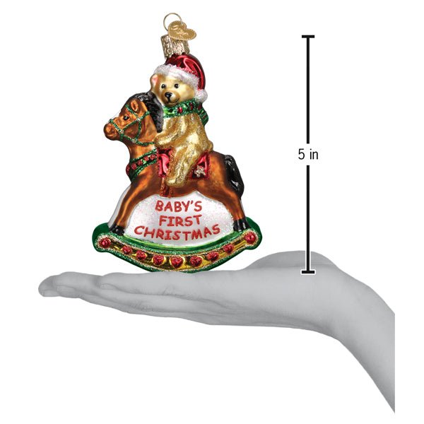 Rocking horse teddy ornament on an open palm beside a 5 inch height marker