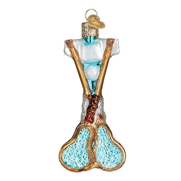 Lacrosse glass ornament with two crossed gold sticks, aqua mesh heads, white ball, and white jersey, on white