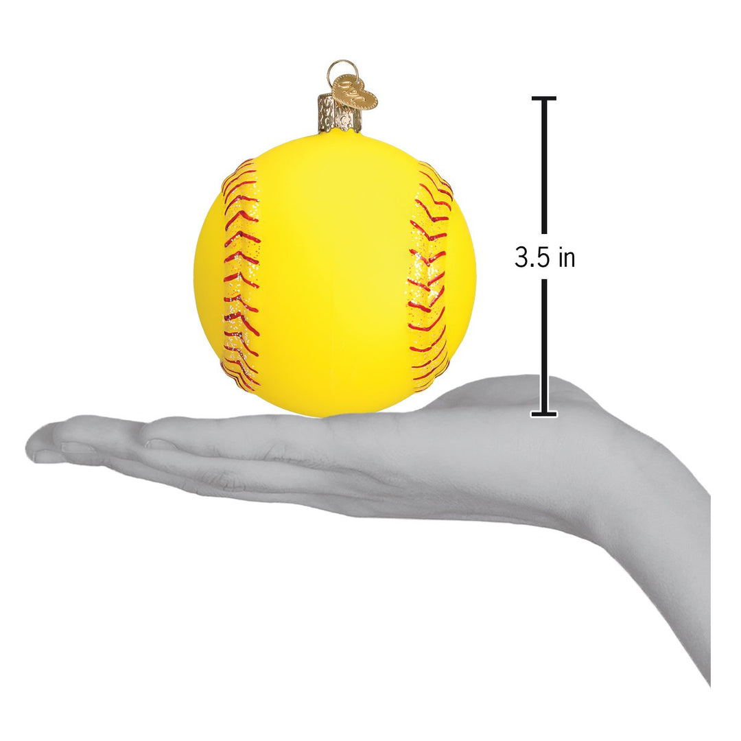 Yellow softball ornament held in an open hand to show its size