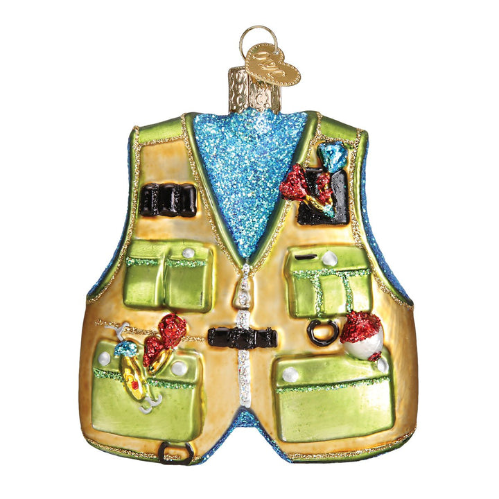 Front of the green and tan fishing vest glass ornament with pockets full of painted gear, on white