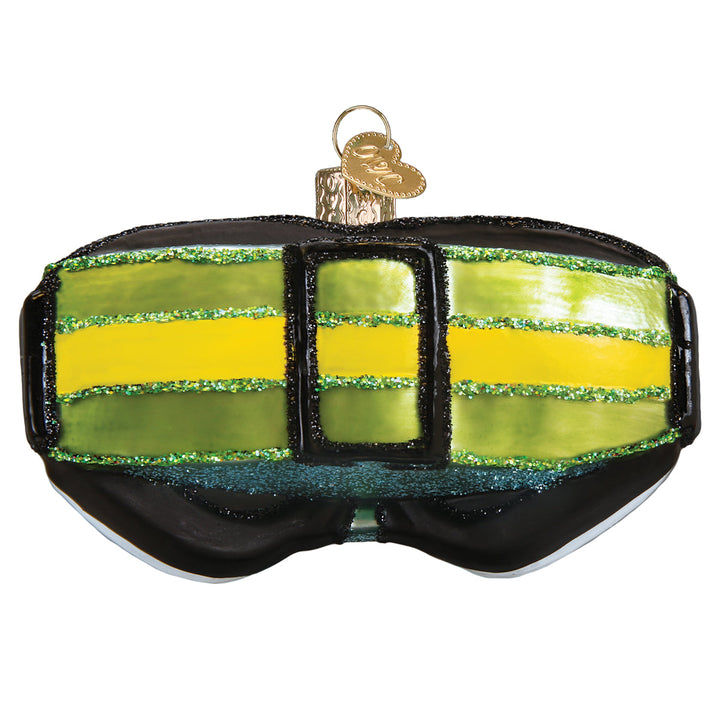 Back of the ski goggles ornament showing the black and lime green strap, on white