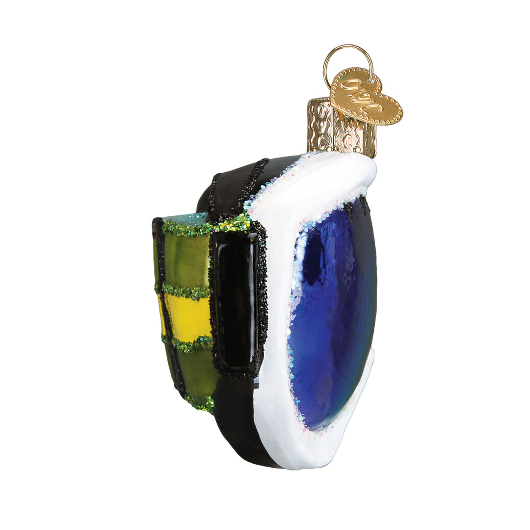 Side view of the ski goggles ornament with the white frame and strap edge, on white