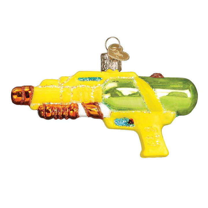 Side view of the yellow squirt gun ornament with a lime green water tank and orange grips, on white