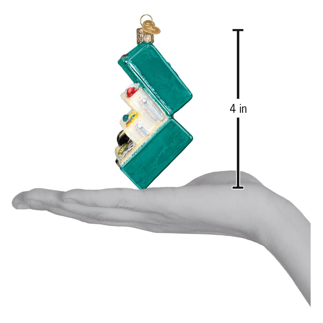 Tackle box ornament on an open palm beside a 4 inch height marker