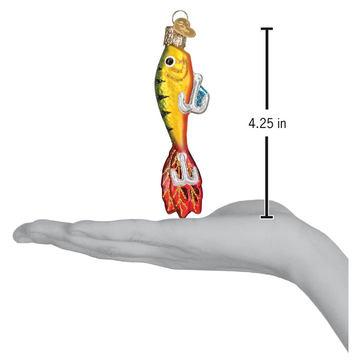 Fishing lure ornament on an open palm beside a 4.25 inch height marker