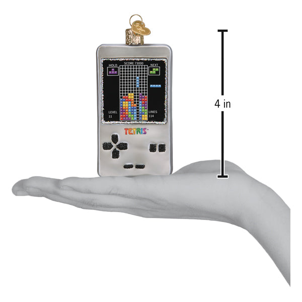 Tetris handheld game ornament shown in an open hand for scale