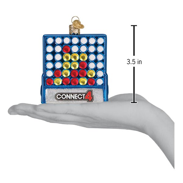 Connect 4 ornament on an open palm beside a 3.5 inch height marker