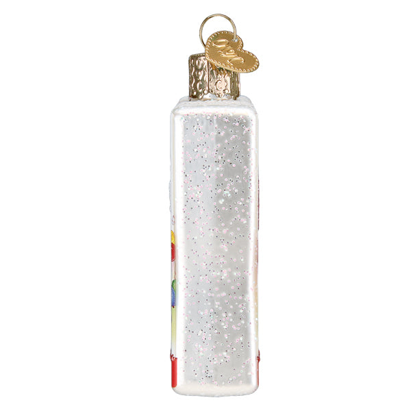 Side view of the Candy Land ornament with its slim white glittered edge