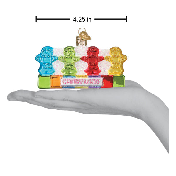 Candy Land Kids ornament shown in an open hand for scale