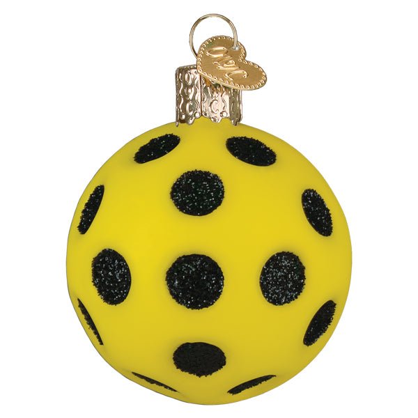 Second side of the pickleball ornament showing more glittered black holes, on white