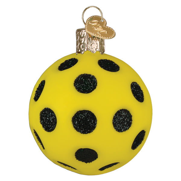 Second side of the pickleball ornament showing more glittered black holes, on white