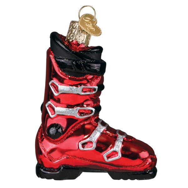 Red ski boot ornament side view with black cuff, silver buckles, and black sole, on white
