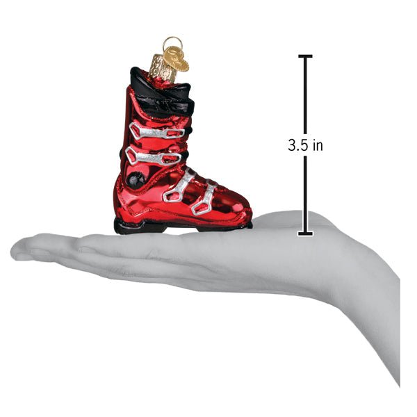 Red ski boot ornament on an open palm beside a 3.5 inch height marker